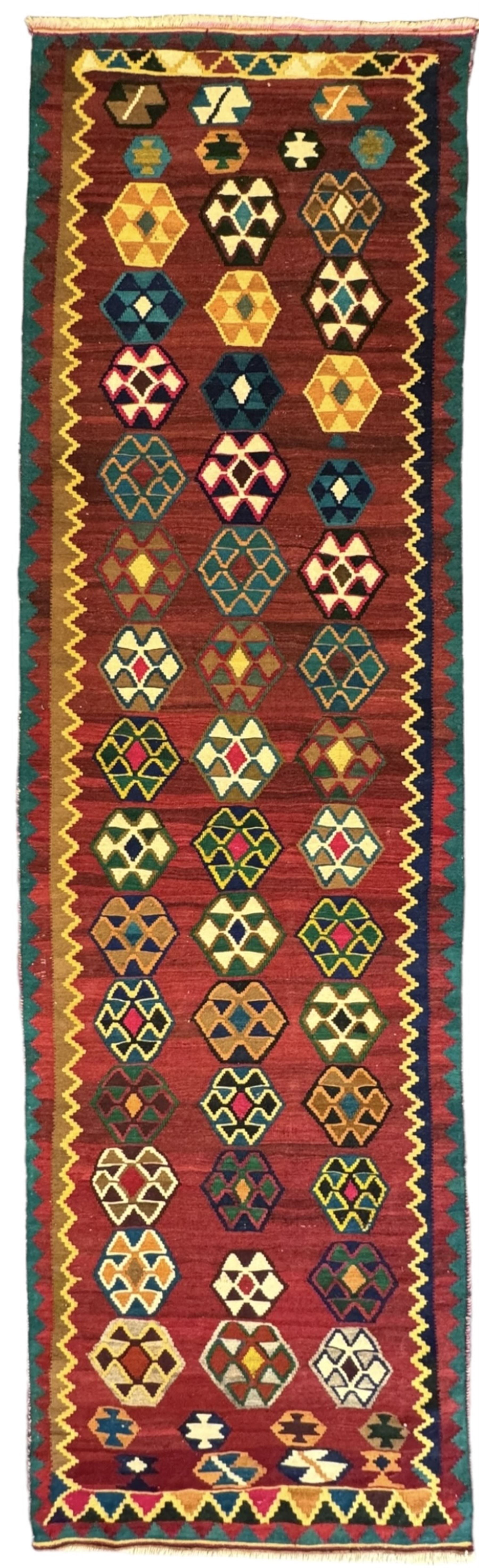 South West Persian Qashqai Kilim, crimson ground and decorated with three rows of geometric motifs, within zig-zag borders 