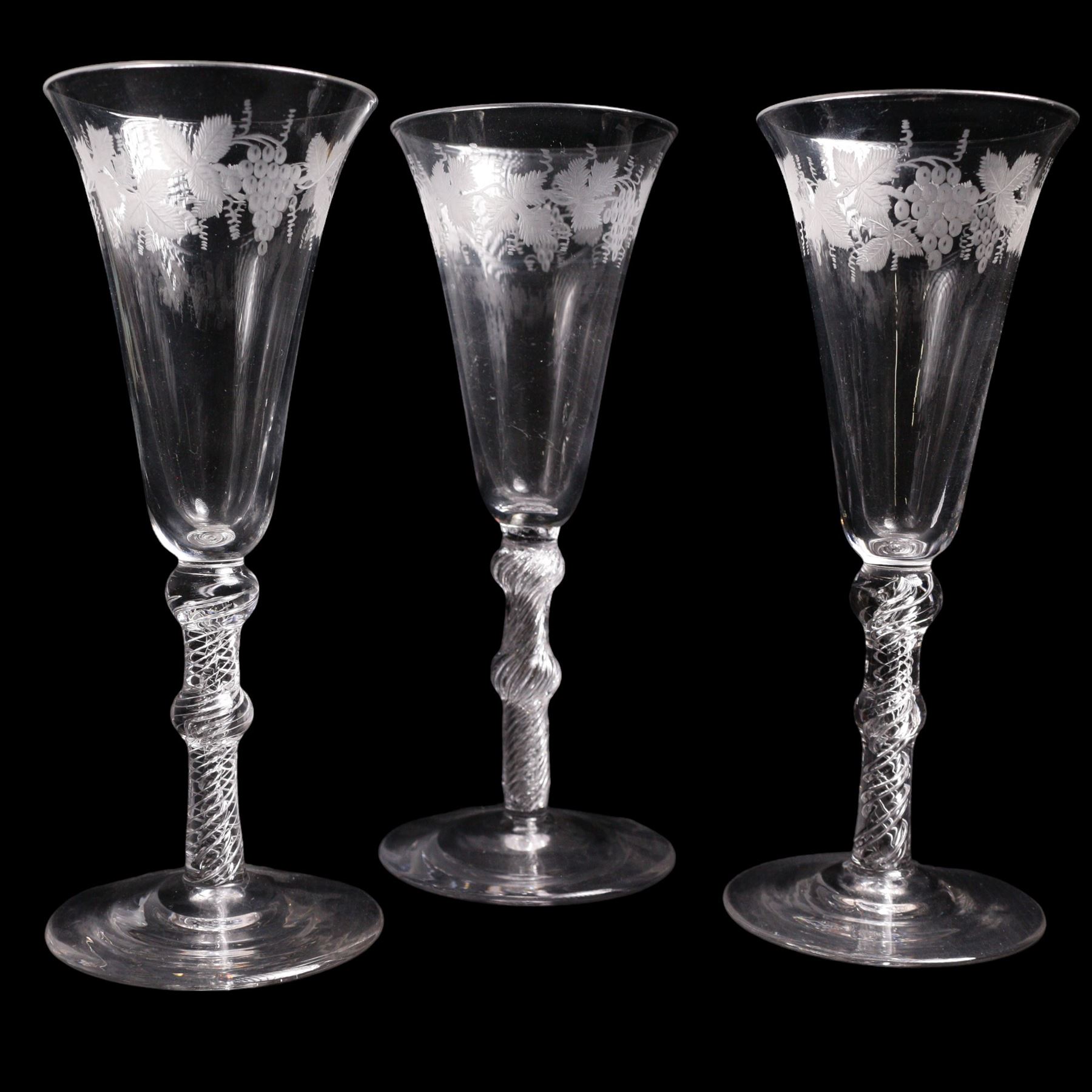 Set of three Georgian style engraved double-knopped multi air twist, with bell shaped bowls with vine engraving, to conical feet, H19cm