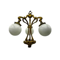 Pair of Art Nouveau design gilt metal ceiling lights, each with three stems connecting glass dome