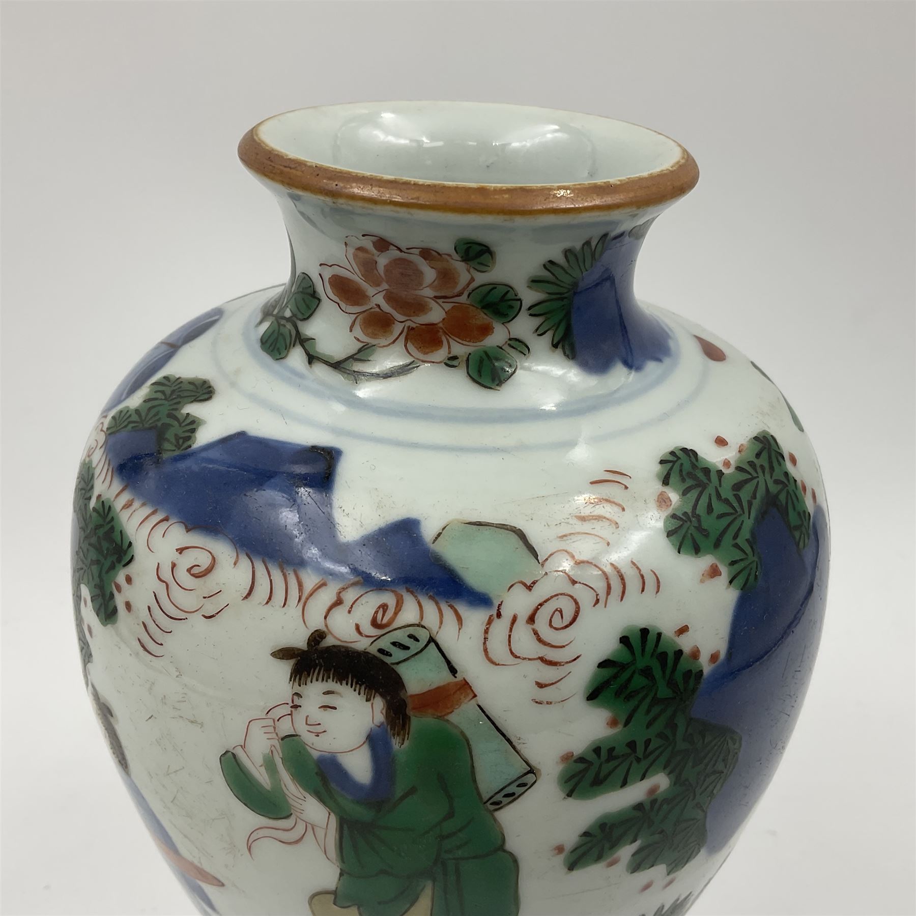 Chinese Wucai vase, of baluster form, decorated with an official and attendants in a garden setting, with crane, fence and rockwork, H19cm