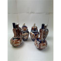 Three pairs of Imari vases, including a pair of baluster form with covers with foo dog finials, tallest H21cm 