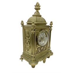 French - Brass cased 8-day mantle clock c1880, with a domed top surmounted by a pineapple finial, four reeded pilasters to the corners and raised on tapered feet, with a conforming dial with cartouche numerals, fleur-di -Lis hands and the name, Phillippe, 66 Palais Royal, Paris, twin train countwheel striking movement sounding the hours and half-hours on a bell.  With pendulum and key. 
