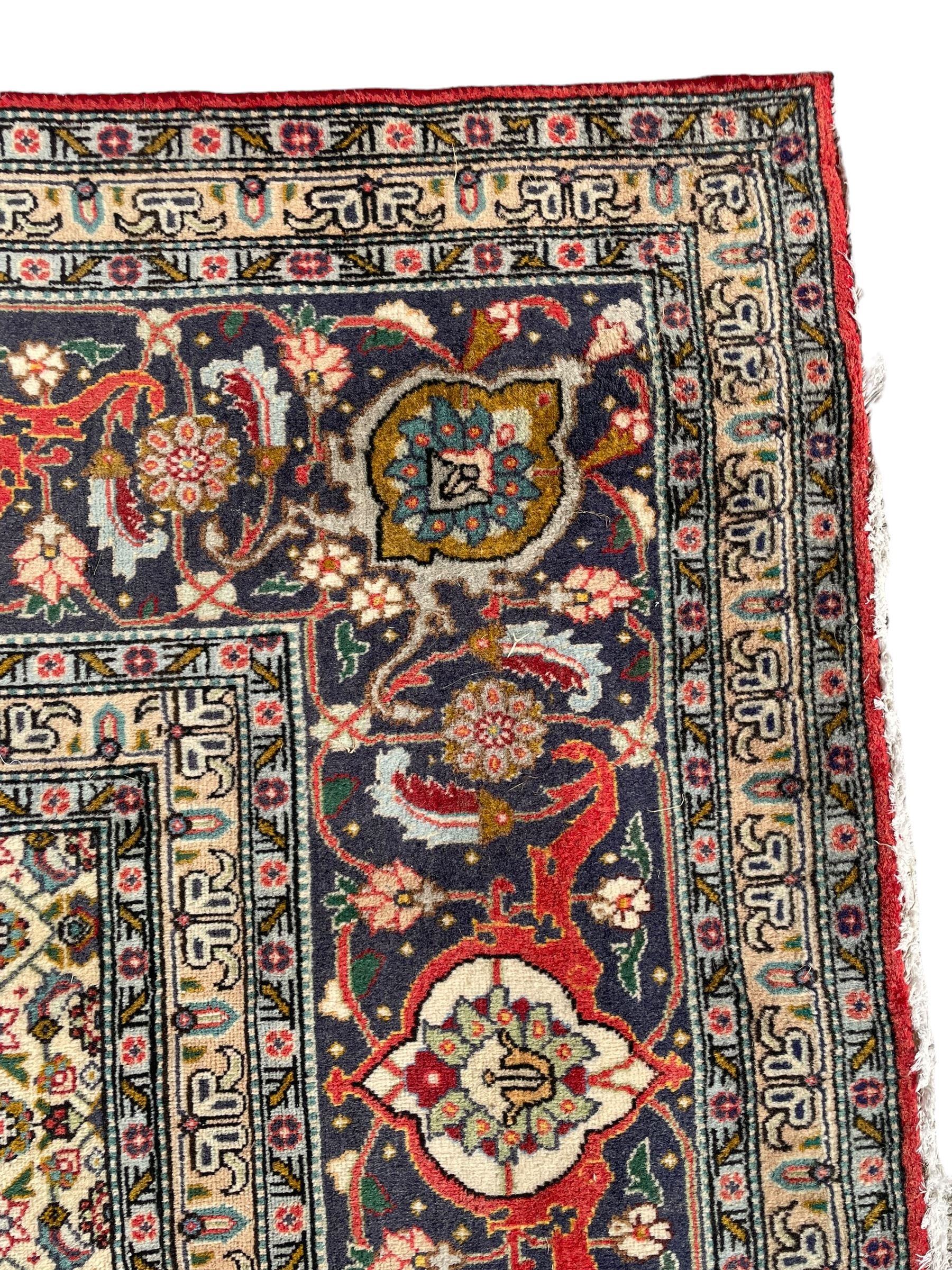 Perisian Bidjar crimson ground rug, within scalloped borders, central pole medallion, the field decorated all over with floral Herati motifs, guarded border decorated with repeating stylised plant motifs and trailing branch 