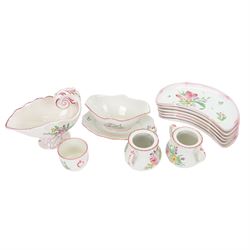 Keller & Guerin Luneville French part tea and dinner service,painted with floral sprays and scattered sprigs within pink edged rims, including covered dish, two meat platters, three coffee pots etc 