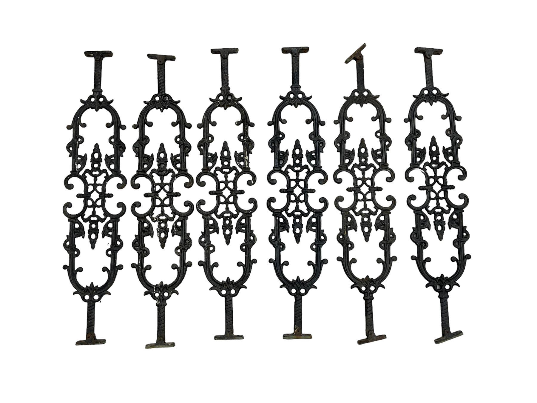 Set of twelve 20th century cast iron staircase baluster rails or balustrade, decorated with foliate scrolls