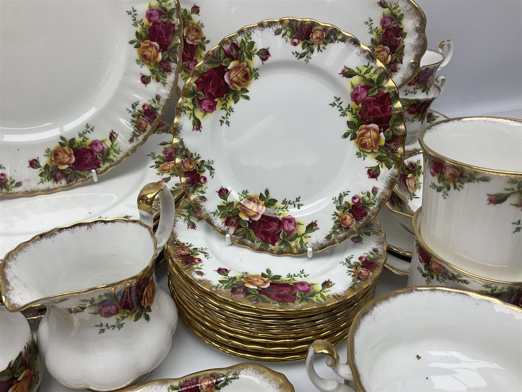 Royal Albert Old Country Roses pattern part tea and dinner service, to include two tureens, eight dinner plates, six side plates, twelve bowls, two mugs, seven teacups and saucers, milk jug,  twelve cake plates, six soup bowls and saucers, candlesticks, etc (95)