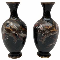 Pair of early 20th century Chinese cloisonné vases, of ovoid form with waisted necks, decorated with dragons upon a black and copper flecked flecked ground, H
