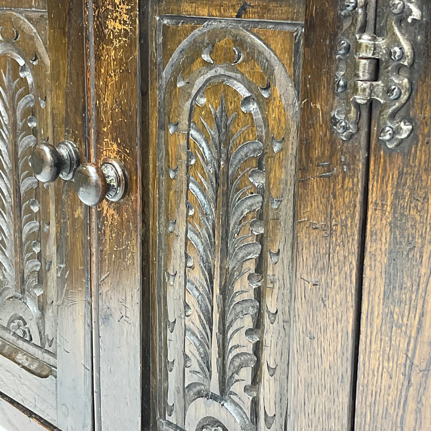 Small oak hutch cupboard, fitted with two carved doors