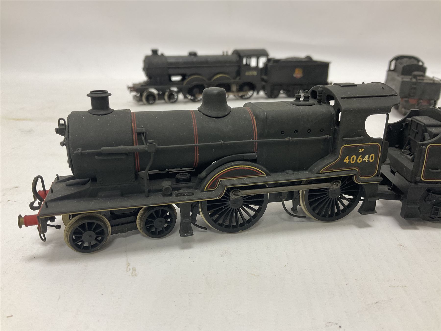 ‘00’ gauge - four hand built locomotives, using various Hornby parts, comprising B12 Class 4-6-0 locomotive no.61570 in BR black; Class 2P 4-4-0 locomotive no.40640 in BR black; Class D15 4-4-0 ‘Claud Hamilton’ locomotive no.62546 in BR black; Class J83 0-6-0T locomotive no.68453; one further hand built tender (5) 