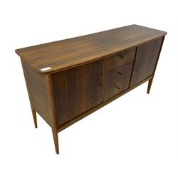 Mid 20th century teak sideboard, rectangular top with rounded corners over three central drawers, flanked by two cupboard doors enclosing shelves, raised on tapered supports