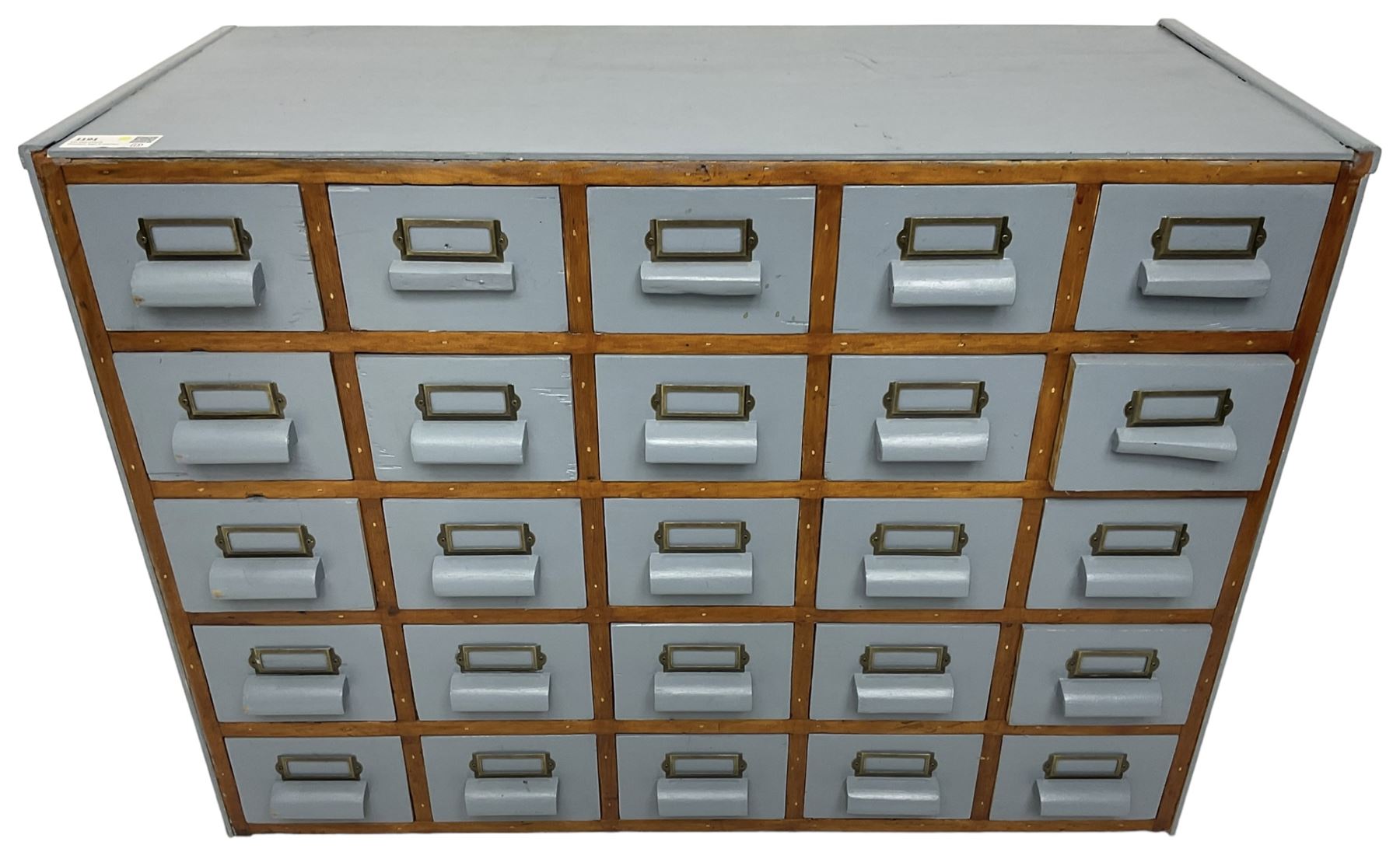 Mid-20th century multi-drawer chest or filing cabinet, fitted with twenty-five small drawers with wooden handles and metal label holders, in light blue paint finish 