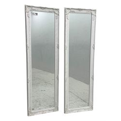 Pair of contemporary rectangular mirrors, each with bevelled glass plates enclosed by moul...