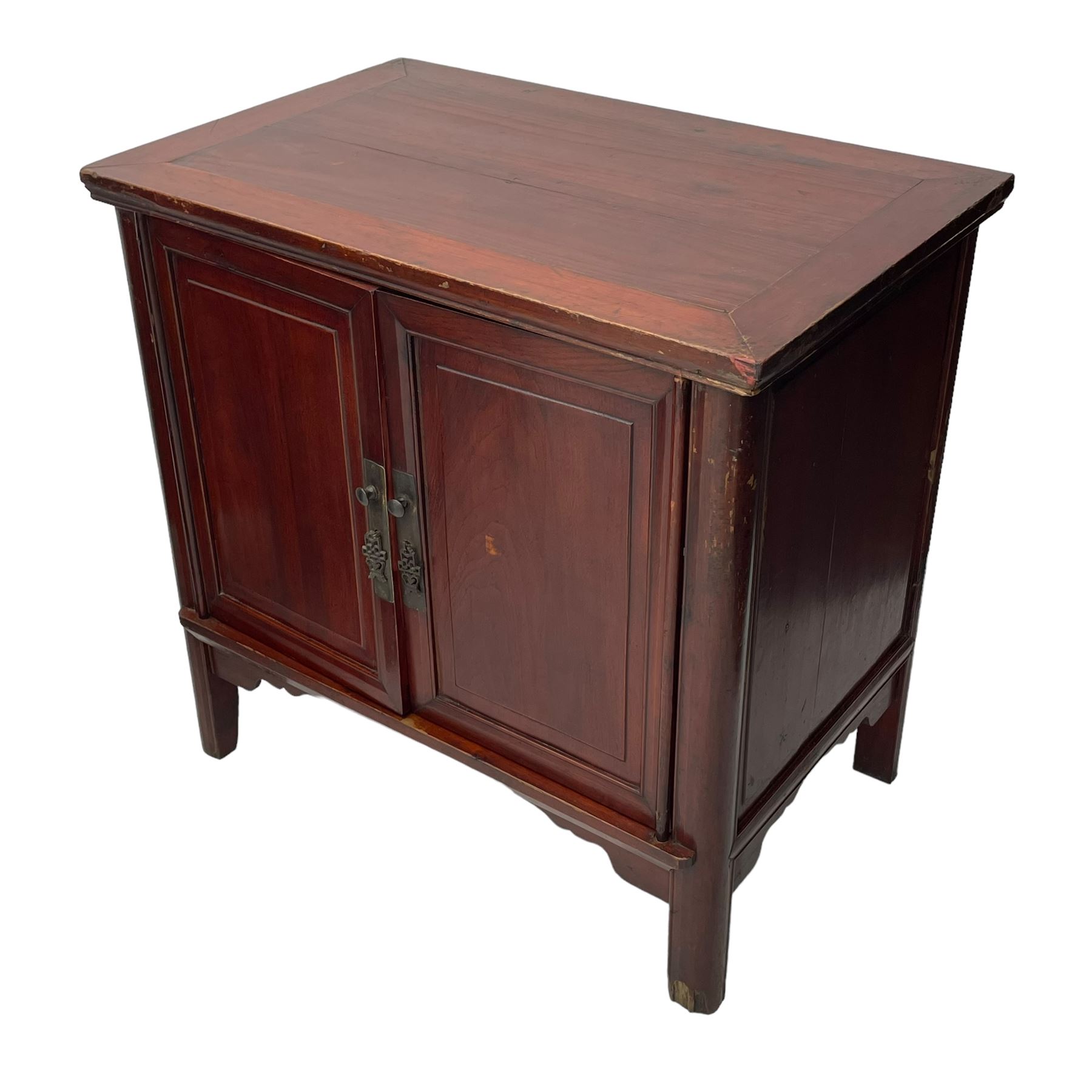 Pair of early 20th century Chinese red lacquered elm storage cupboards, rectangular top over two panelled doors, fitted with two internal drawers, on square supports with curved outer edge, panelled sides