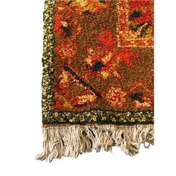 Moroccan amber ground thick pile rug, the plain ivory field decorated with a central pole medallion of star form, the wide guard bands decorated with repeating geometric and foliate patterns