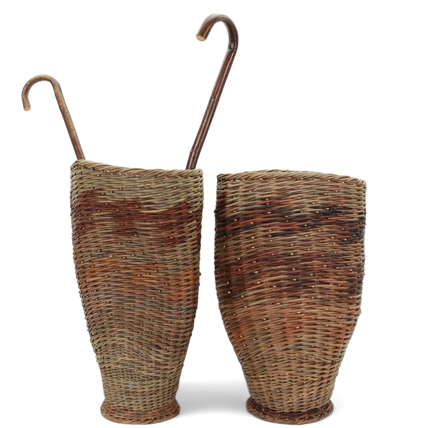 Two rattan baskets, of circular abstract form, together with two crook walking stick, basket H62cm 