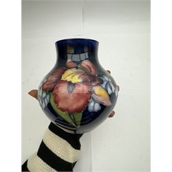 Moorcroft vase of squat baluster form in Orchid pattern H14cm