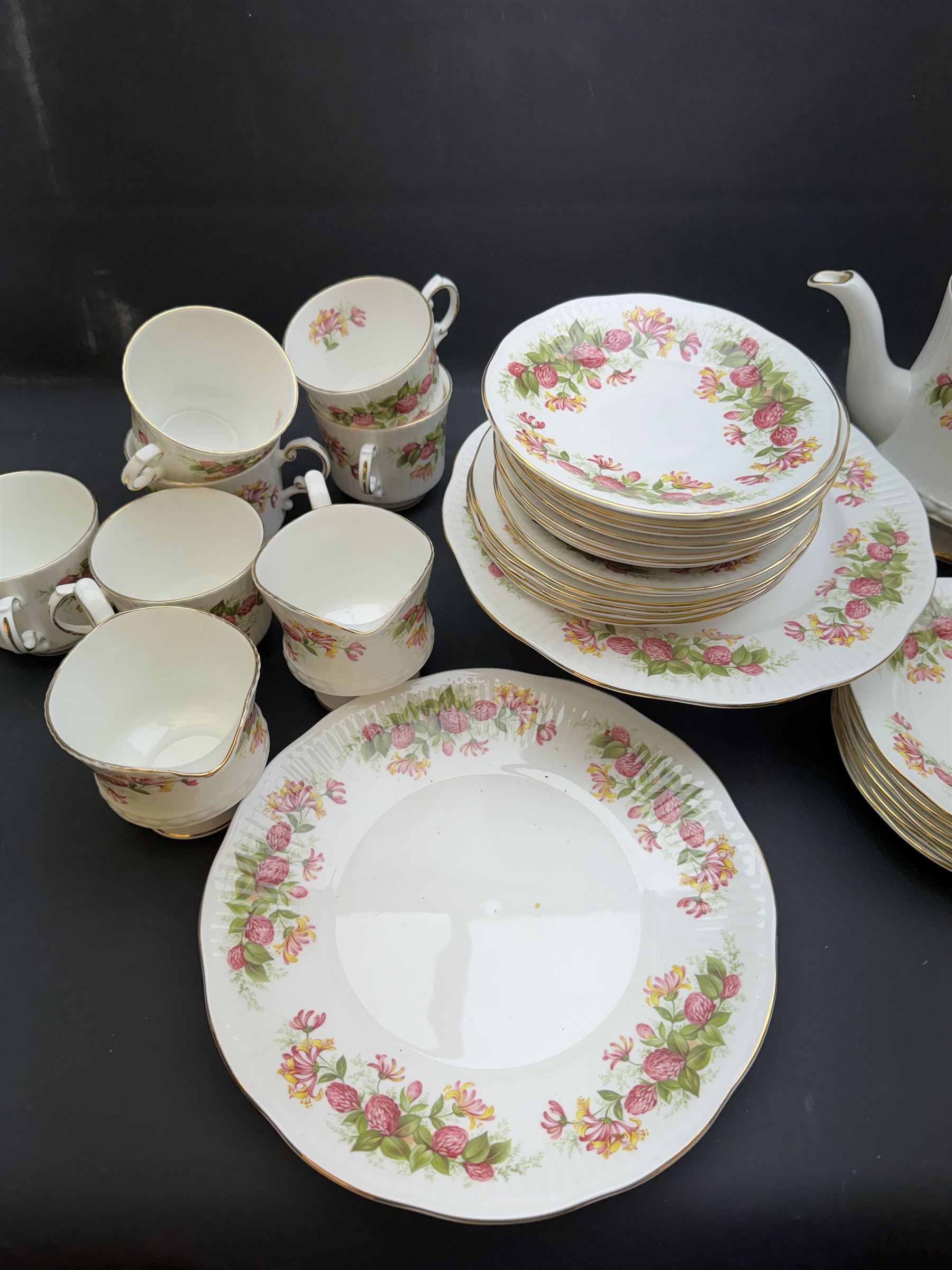 Queens, Woman & Home pattern tea service, including teapot, milk jug, seven teacups etc 