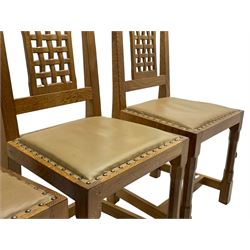 'Rabbitman' set of eight oak dining chairs, pierced lattice backs, upholstered seats with studwork band, octagonal front supports joined by stretchers, carved with rabbit signature, two carvers and six side chairs, by Peter Heap of Wetwang
