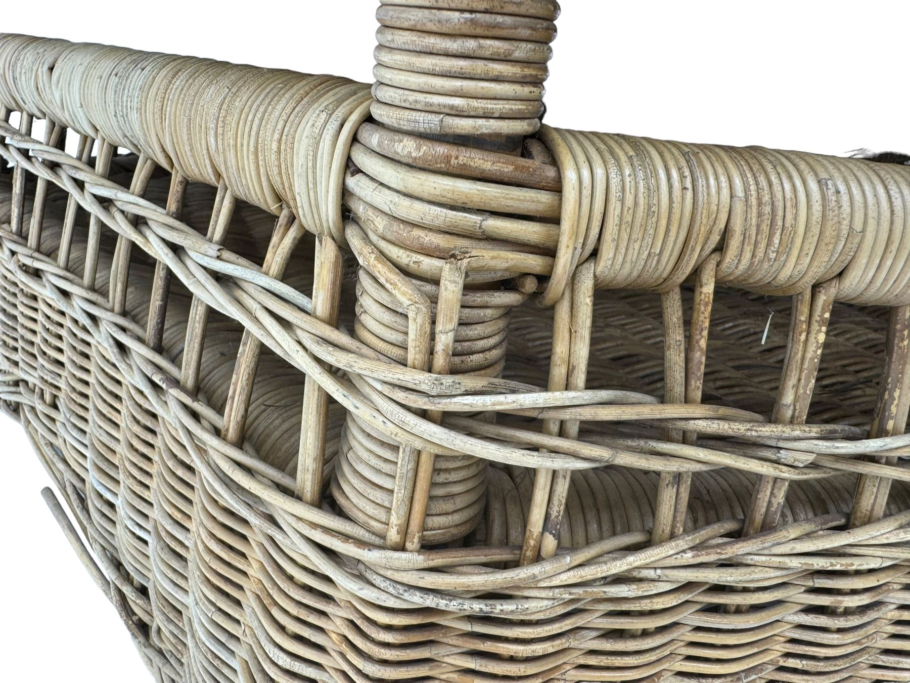 Mid-20th century hexagonal wicker coffee table, featuring woven top with pattern that radiates from the centre, lower shelf for additional storage, supported by interwoven wicker legs