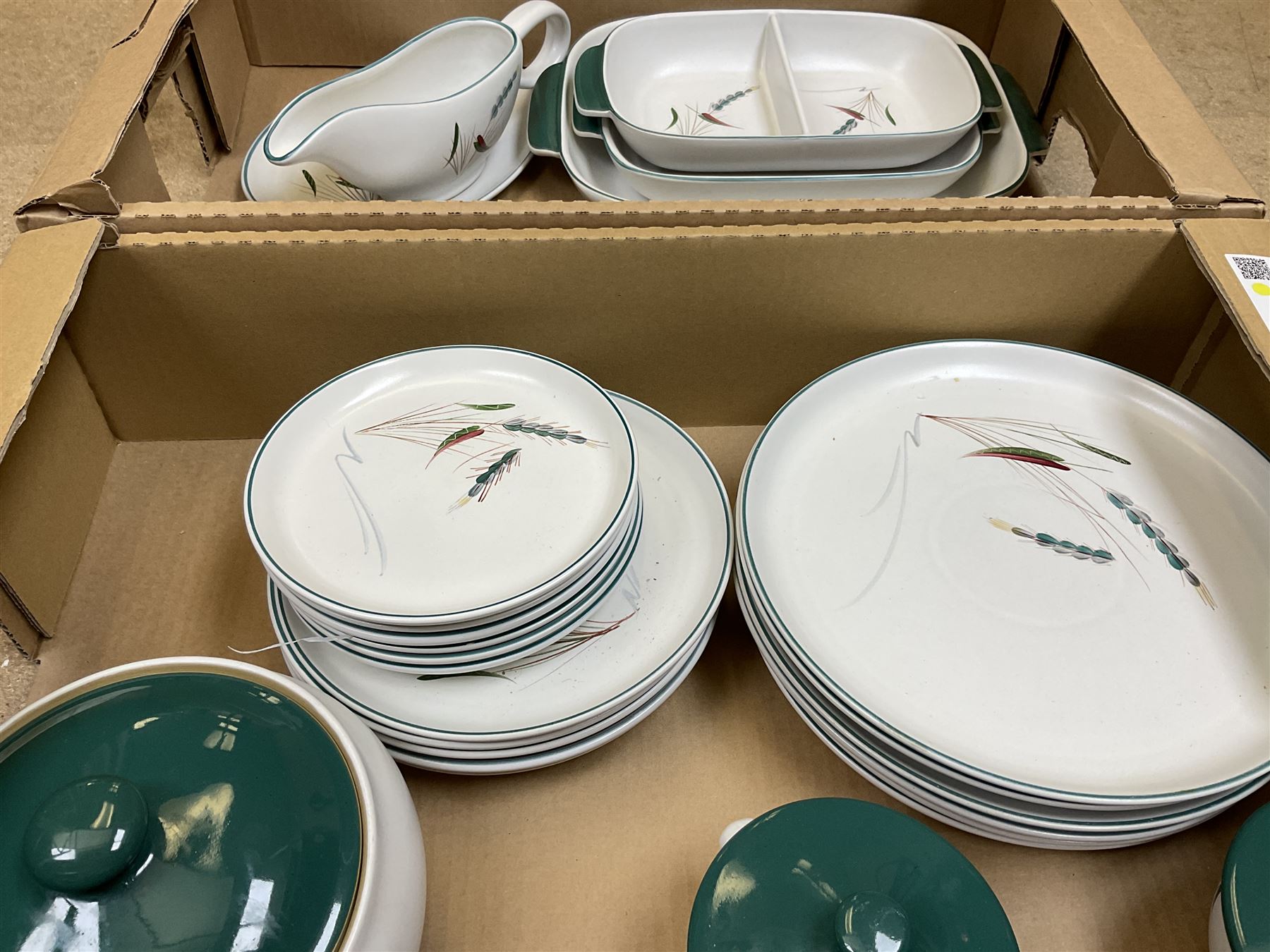 Denby part dinner service, decorated in the Greenwheat pattern, comprising dinner plates, dessert plates, side plates, lidded tureen, pair of smaller lidded dishes, sauce boat, and various serving dishes, in two boxes