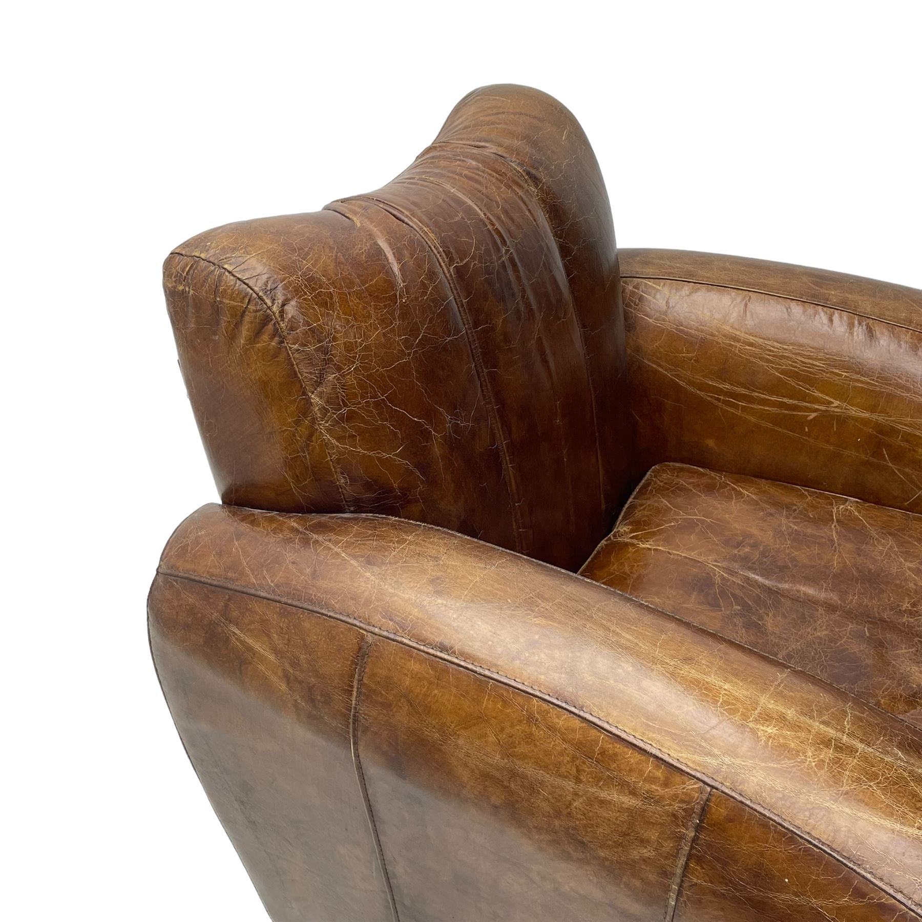 Rockson - club armchair, dished cresting rail over curved arms, upholstered in brown stitched leather, on block feet