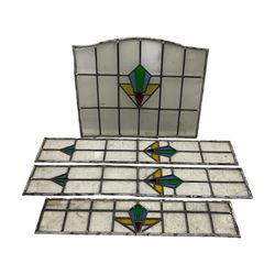 Four early 20th century stained glass and leaded windows, Art Deco design in blue, green, gold and red, largest 67 x 57cm, smallest 19 x 85cm. 