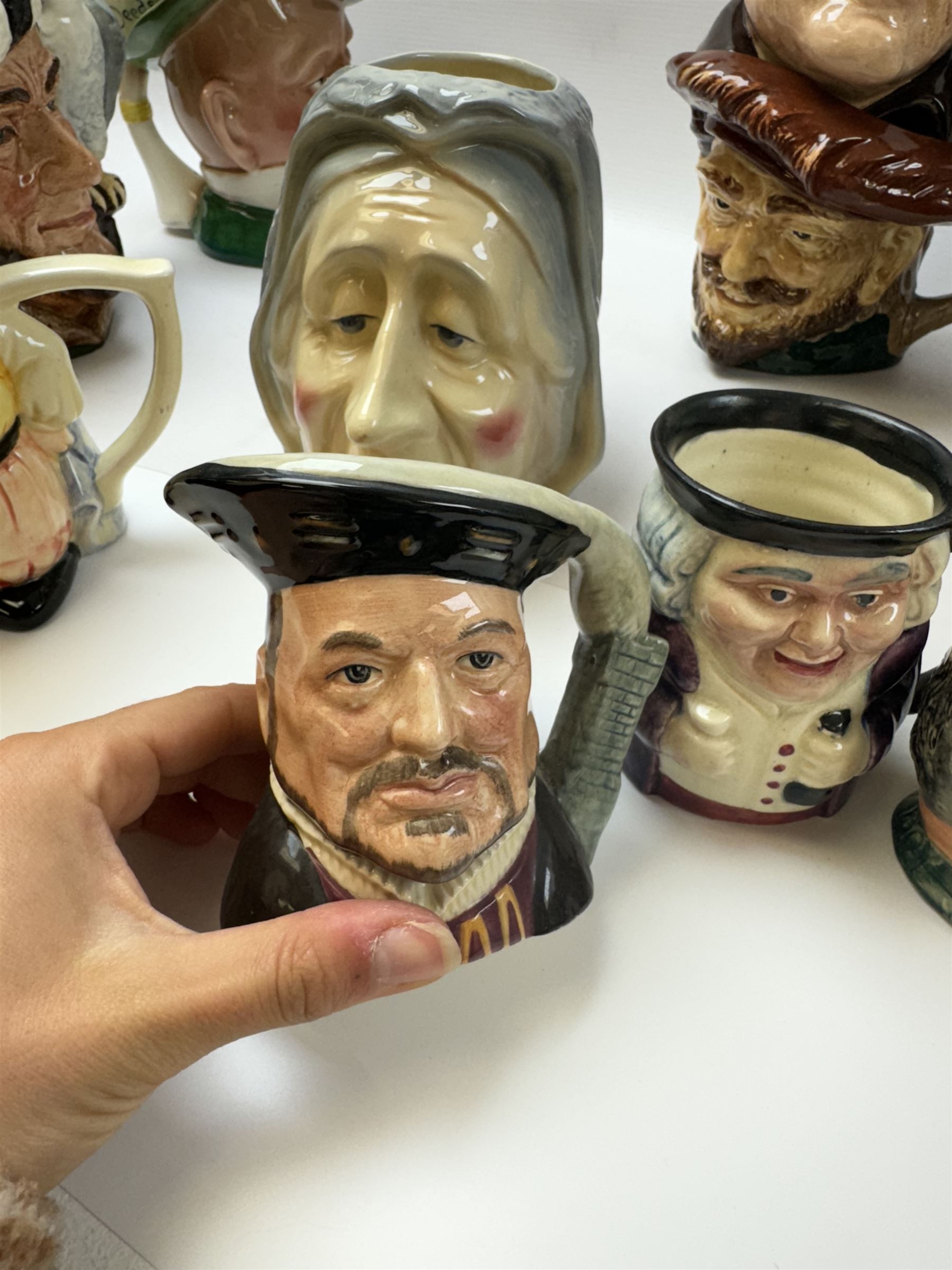 Collection of character jugs, including Royal Doulton Long John Silver, The Falconer, Granny etc