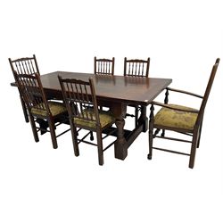 Oak refectory dining table, rectangular cleated top on turned supports joined by H-stretcher; together with set of six (4+2) oak spindle back dining chairs, with upholstered drop-on seat cushions, turned supports joined by turned stretchers