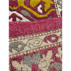 Persian design red ground rug, decorated with stylised plant motifs, repeating border within Boteh decorated guard stripes 