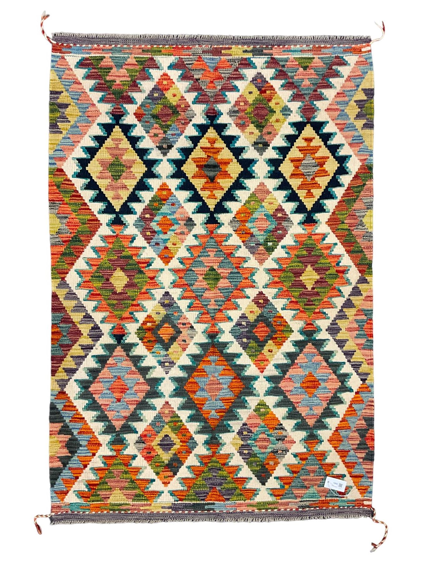 Chobi Kilim rug, over geometric design, decorated with multi-coloured stepped lozenges