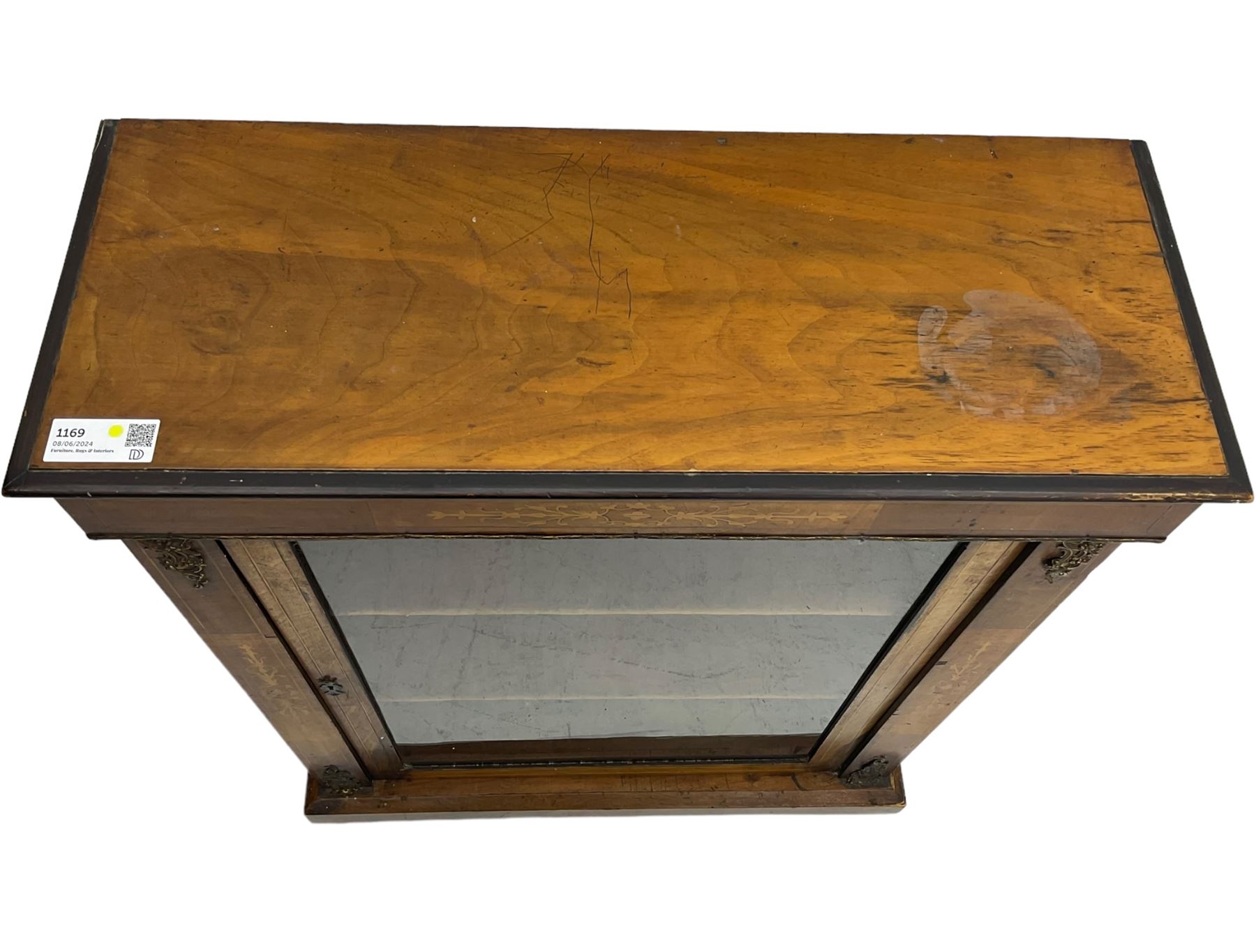 Victorian inlaid walnut pier cabinet, moulded rectangular top over single glazed door, chamfered plinth base, on turned feet 