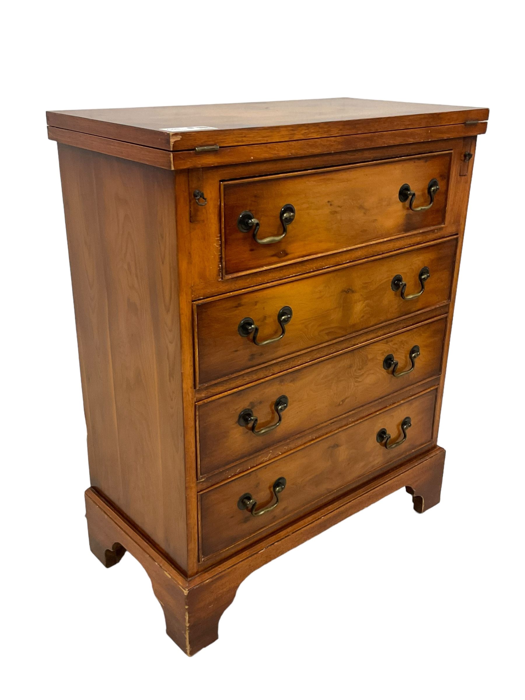 Georgian design yew wood bachelor's chest, fold-over rectangular top supported by pull-out stays, fitted with four long cock-beaded drawers, on bracket feet