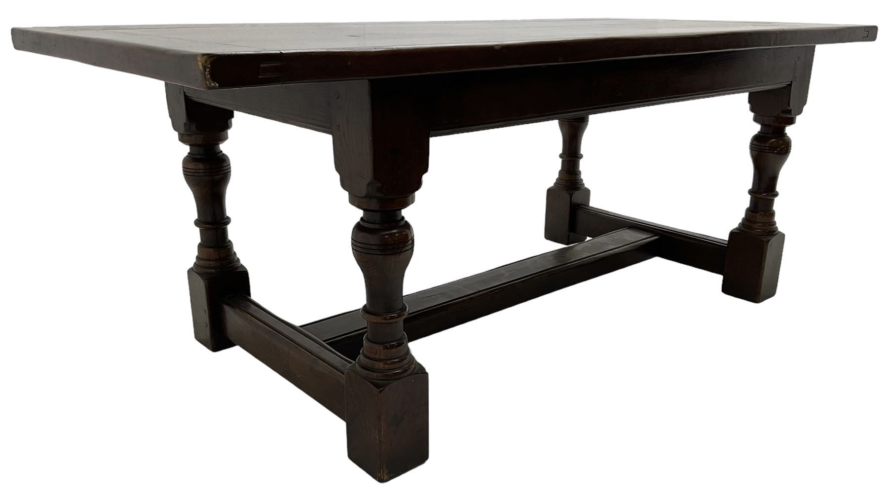 20th century oak refectory dining table, rectangular cleated top on turned supports joined by H-stretcher