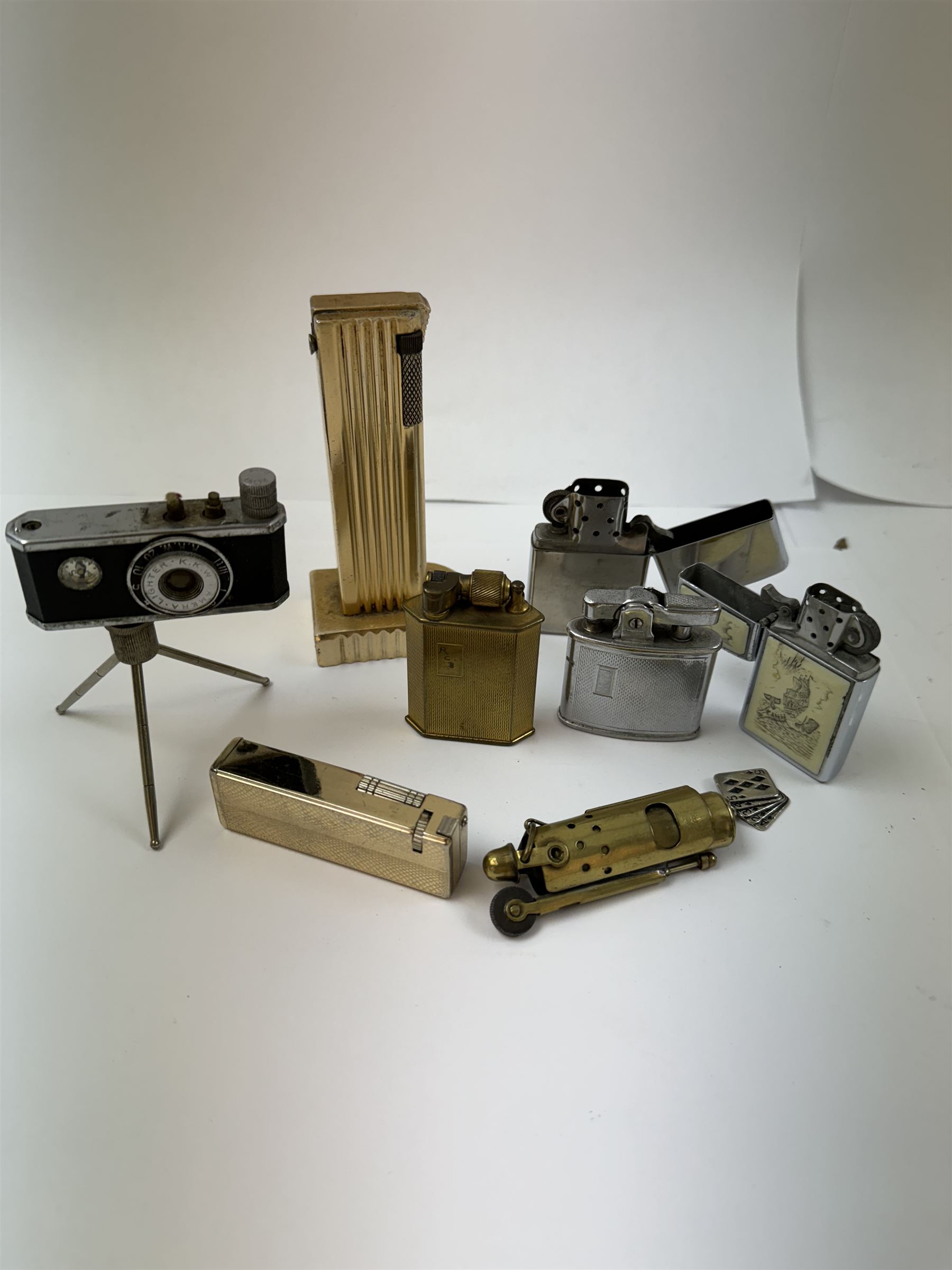 Novelty KKW camera lighter, together with a collection of other lighters, including McMurdo lighter, Benlow Golmet table lighter, Ronson examples, etc