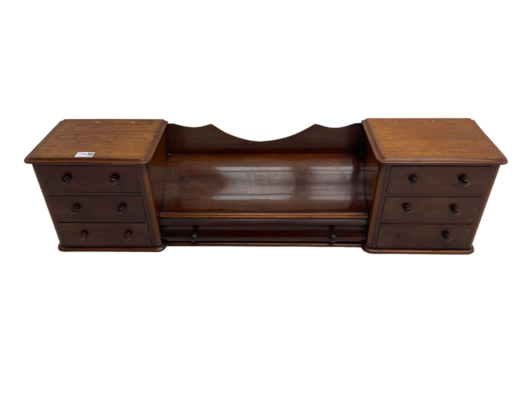 Victorian mahogany correspondence or trinket stand, two banks of three small drawers flanking long central drawer