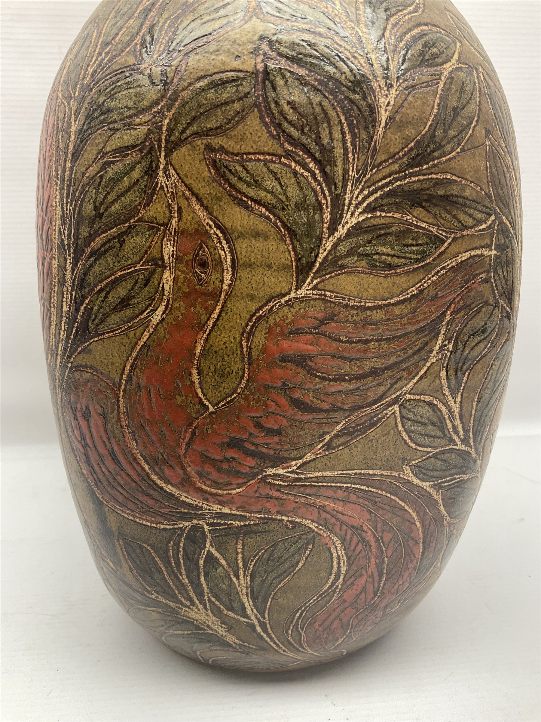 John Egerton (c1945-): studio pottery stoneware vase decorated with red birds in foliage, upon a brown ground, H34cm