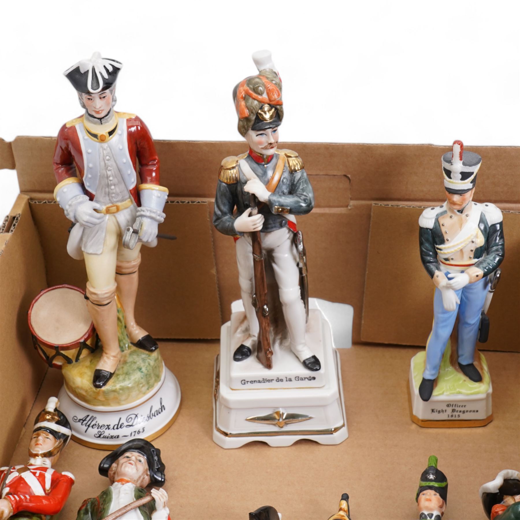 Collection of continental porcelain and bisque military figures in one box