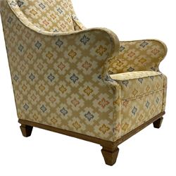 Spanish high back throne armchair, arched cresting rail over scooped arms, upholstered in gold and ivory patterned fabric, on a pitch pine base with spade feet