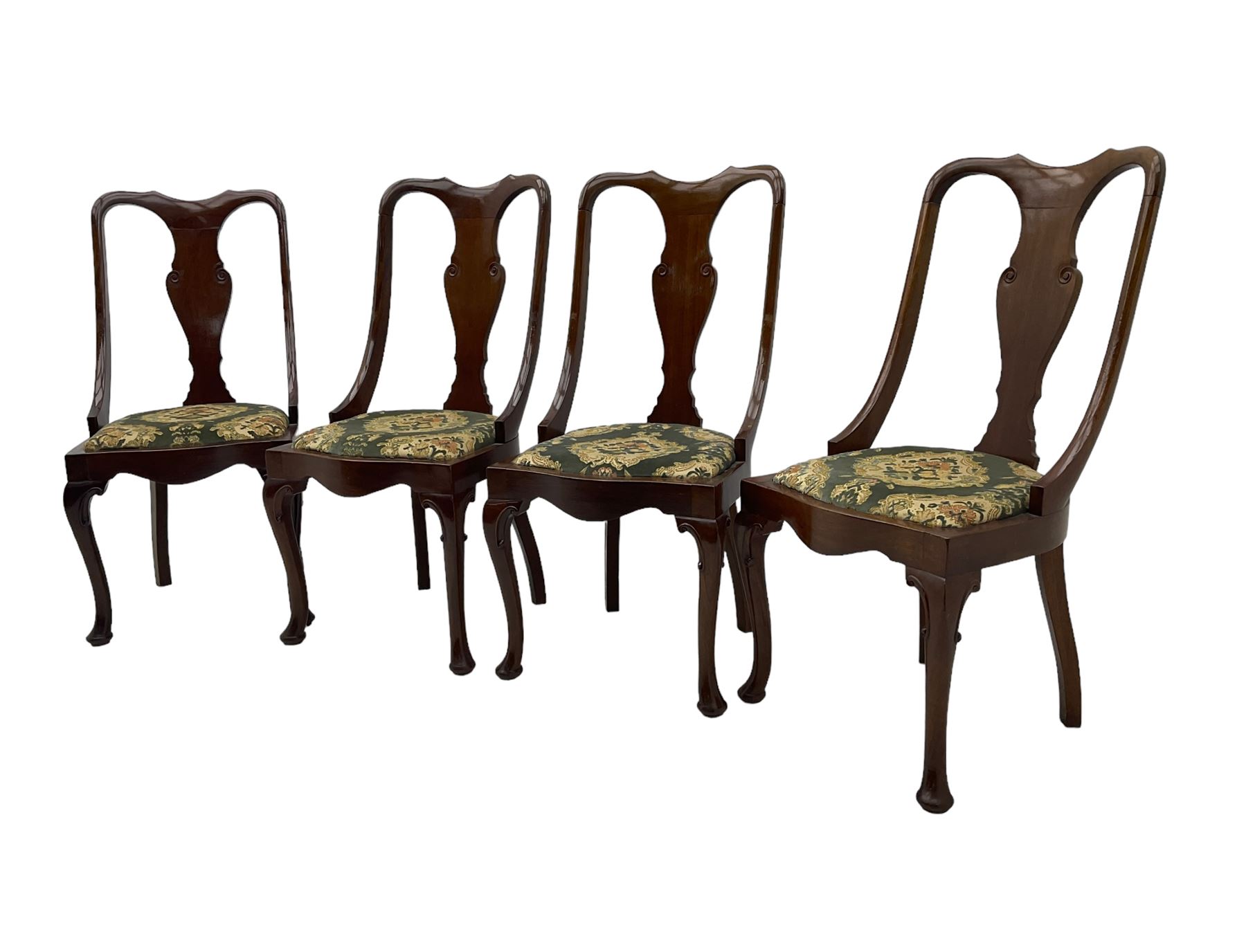 Set of eight late 19th century mahogany spoon back dining chairs, each with shaped top rail over Queen Anne design vase-shaped splat, upholstered seats in floral patterned fabric, raised on cabriole supports with scroll carved knees