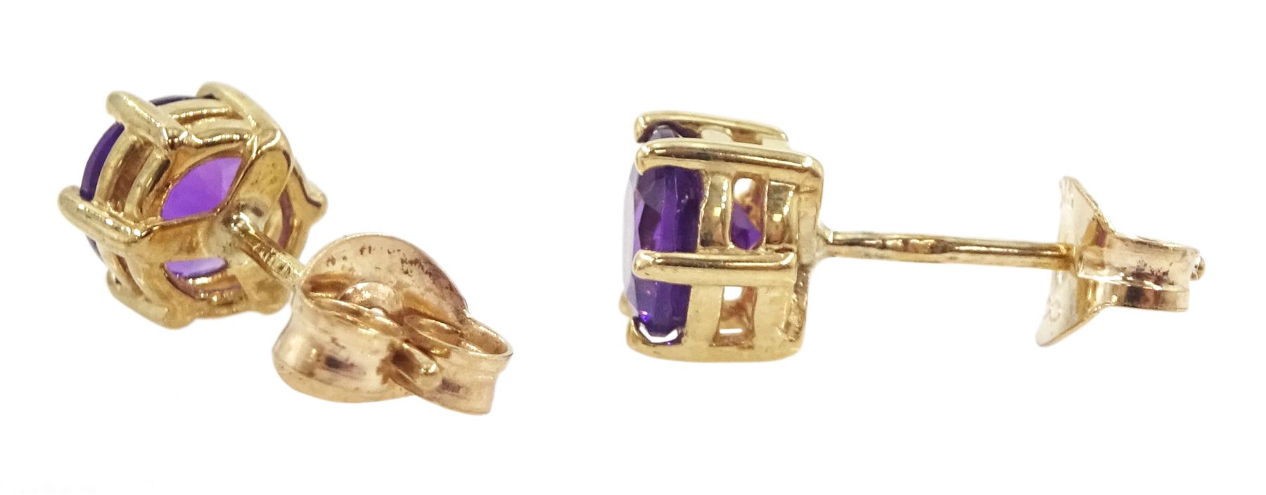 Two pairs of 9ct gold amethyst stud earrings, both hallmarked