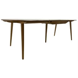 Ercol - light elm and beech 'Slide Leg Expanding Dining Table (444)', rectangular top with rounded corners, raised on tapered splayed supports, with two additional leaves