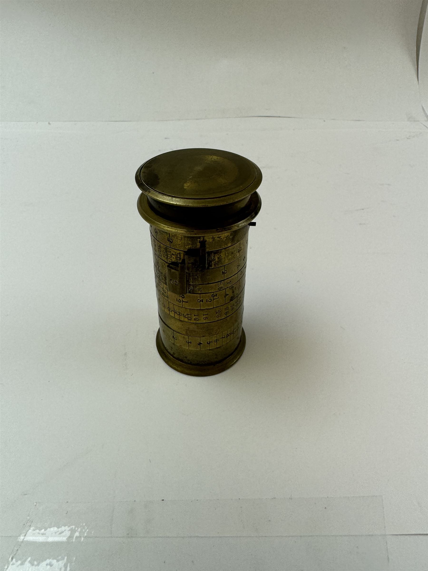 Late 19th century Watkins Exposure Meter, in cylindrical brass case, inscribed Sole Makers R. Field & Co, Birmingham, together with a 19th century brass plate camera lens