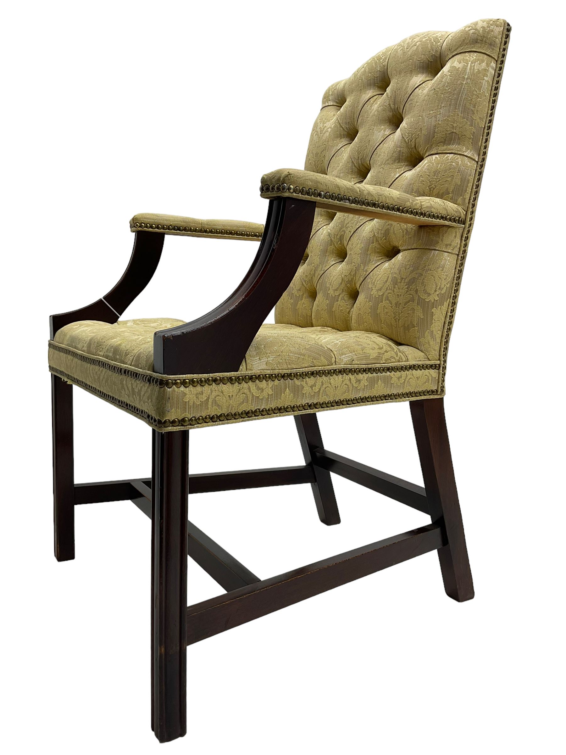 Georgian design mahogany framed Gainsborough open armchair, upholstered in pale gold buttoned fabric with floral pattern, on square moulded supports united by plain stretchers 