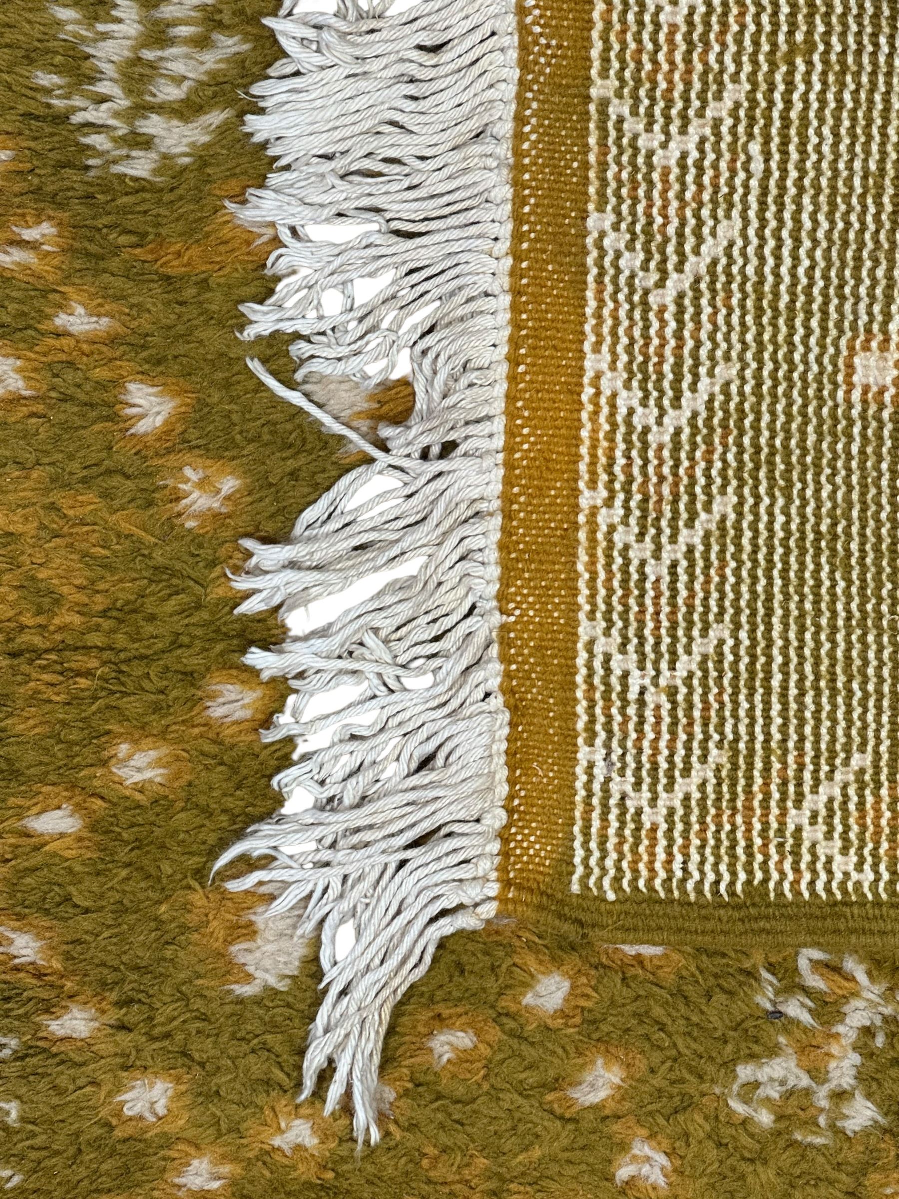 Moroccan citrine ground thick pile runner rug, the field decorated with geometric design and interspersed tribal motifs, enclosed by a chevron pattern guard band