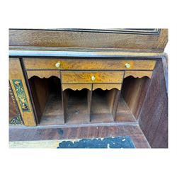 Early 19th century mahogany bureau bookcase, the projecting cornice over two Gothic-style astragal glazed doors enclosing two adjustable shelves, sloped hinged lid enclosing fitted interior and felt inset, four graduating drawers, on bracket feet