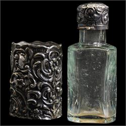 Pair of silver mounted glass scent flasks H20cm London 1916 Maker J H Worrall, Son & Co Ltd, , another matching of tapering form, a small scent flask in outer silver sleeve Birmingham 1902 and various silver mounted glass scent flasks, vases etc  (11)