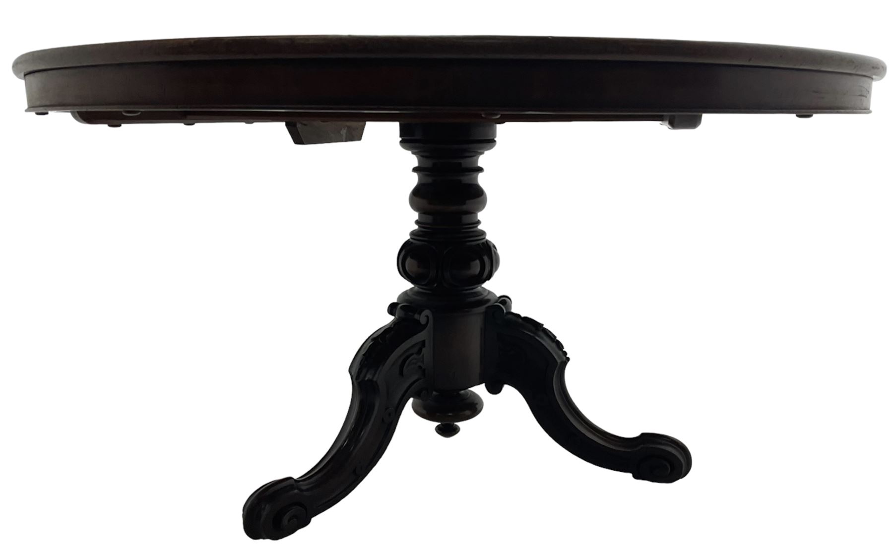 Victorian mahogany breakfast table, the circular tilt-top on carved pedestal, three moulded supports carved with bellflowers and scrolled terminals 