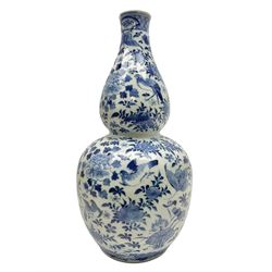 19th century Chinese blue and white double gourd form vase, decorated with blooming peonies and birds in flight, H36cm