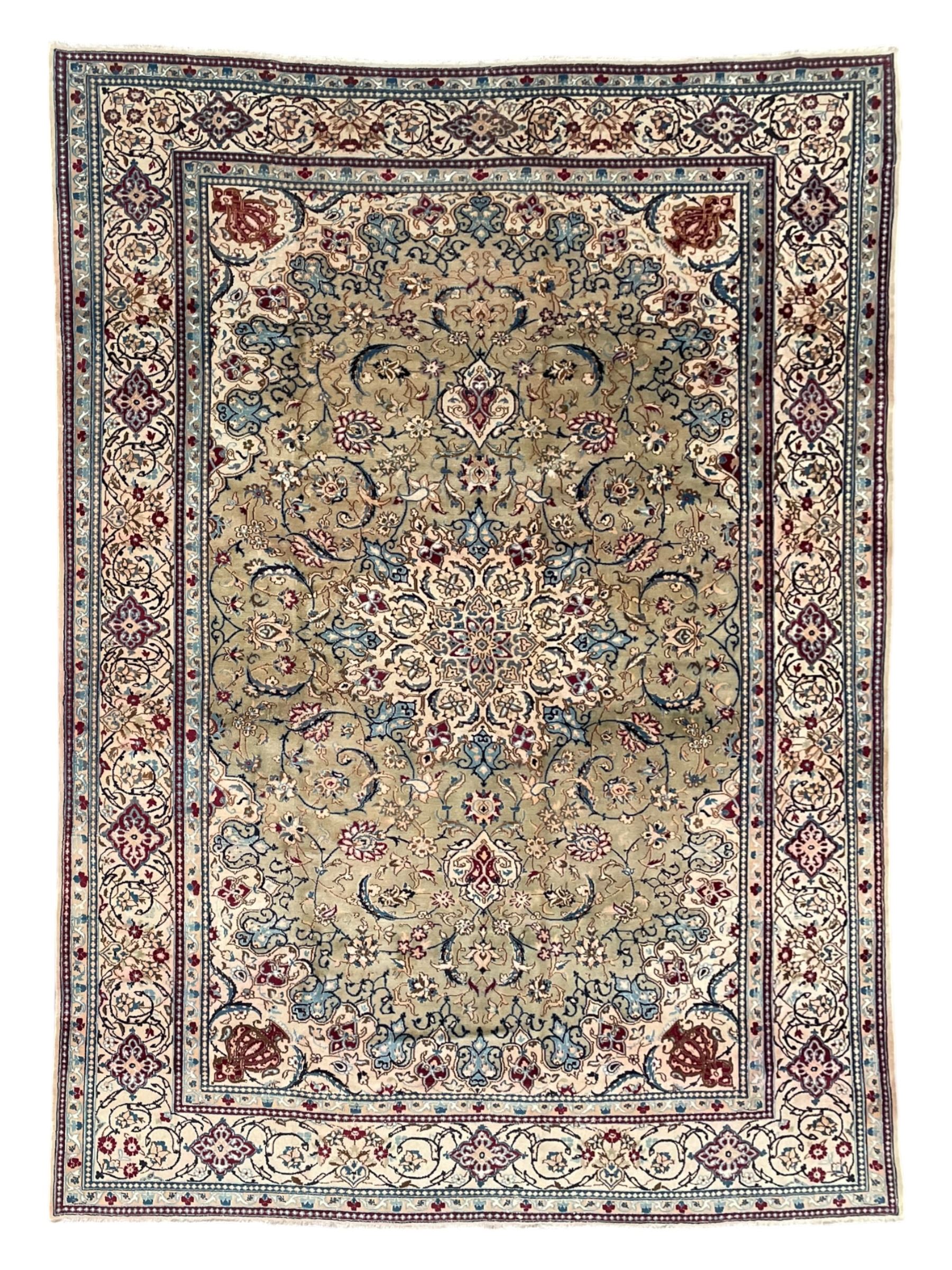 Persian Kashan olive ground carpet, central rosette medallion surrounded by swirling leafy branches and palmettes, the spandrels decorated with further palmettes and foliate motifs, scrolling border interspersed with stylised plant motifs, with in guard stripes