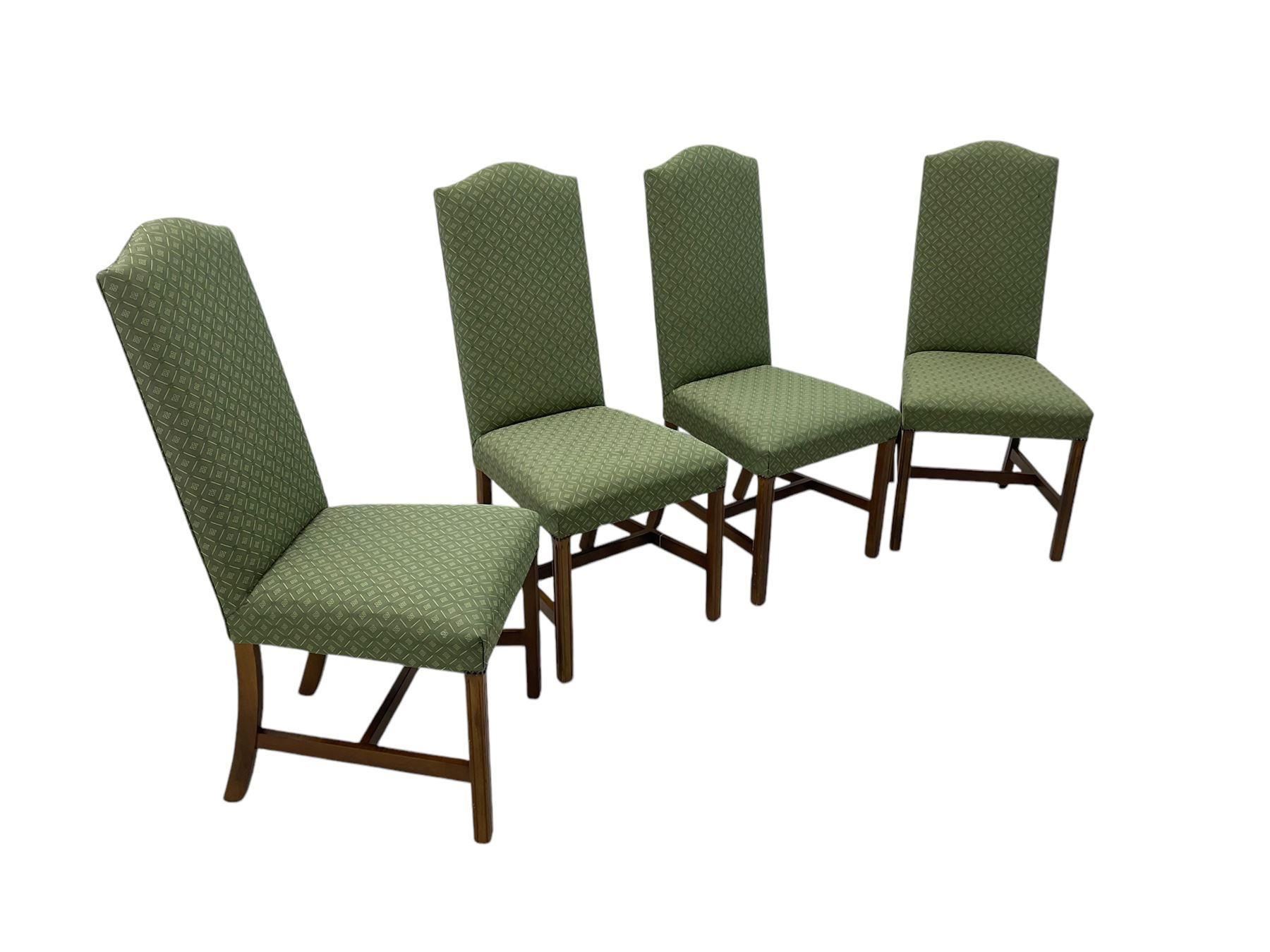 Early 20th century oak extending dining table, rectangular top with rounded corners, on turned baluster supports united by X-stretchers, fitted with a pull-out extending mechanism (106 x 142 - 228cm, H76cm); set of eight high-back dining chairs upholstered in green fabric with geometric diamond pattern